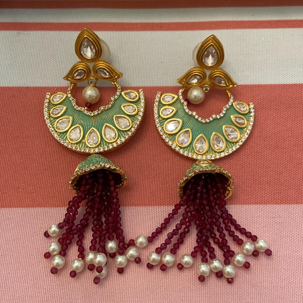Pair Meenakari style earrings with pair shaped rhinestones and pearl accents.